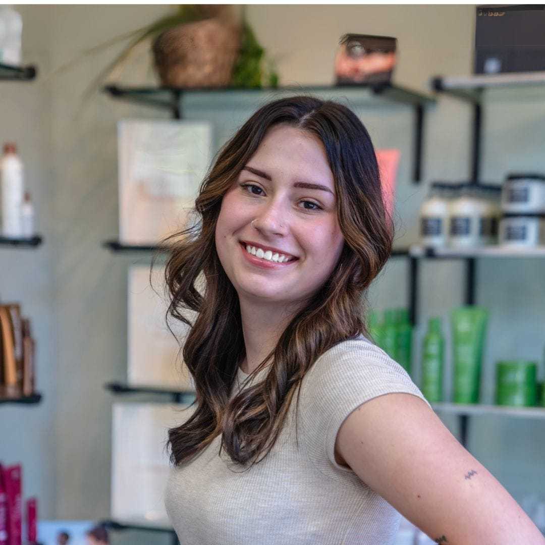 Portrait of Olivia, a professional stylist at Salon Sublime, showcasing their expertise and style.