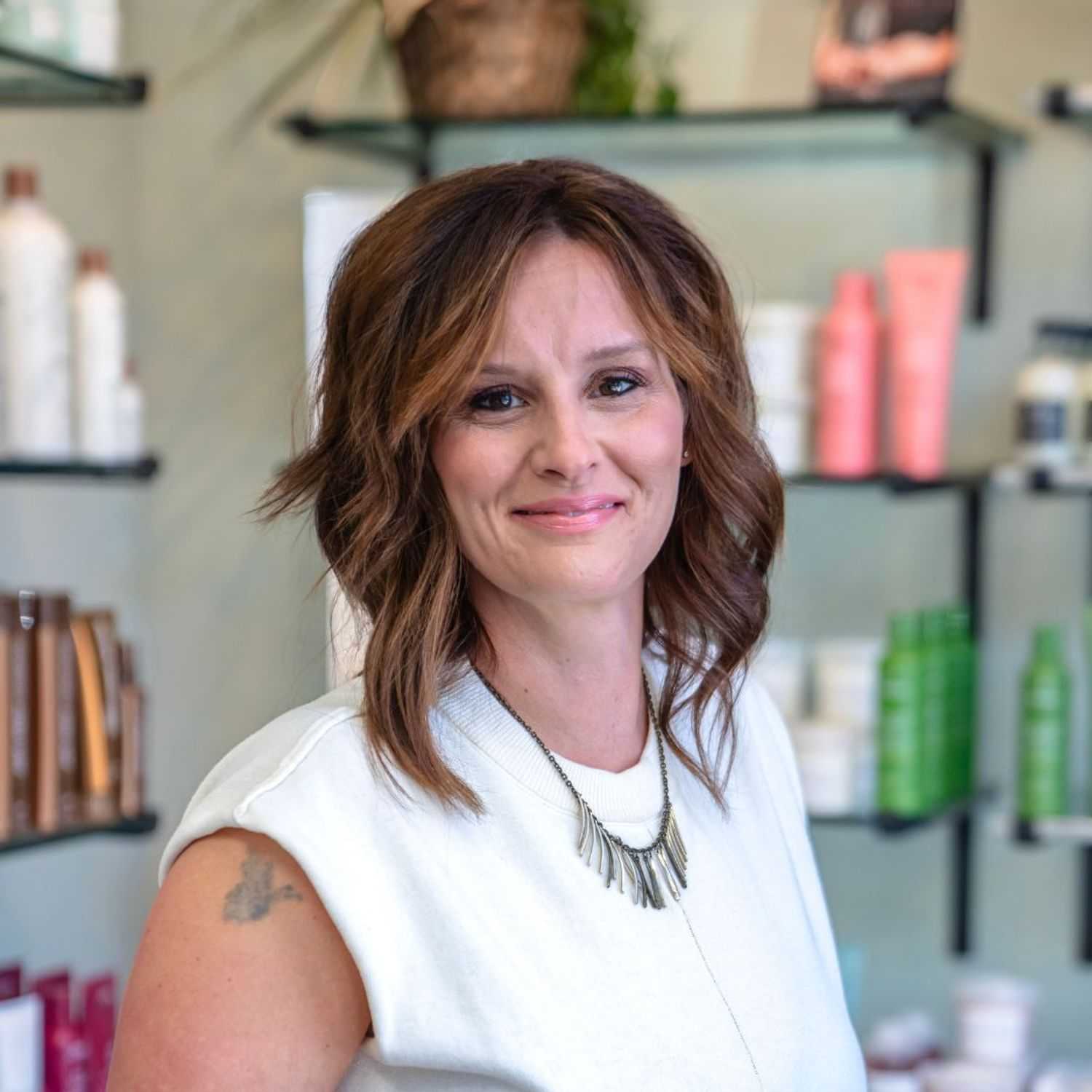Portrait of Jen, a professional stylist at Salon Sublime, showcasing their expertise and style.