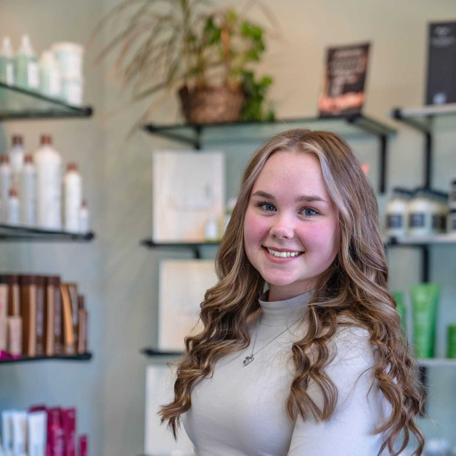 Portrait of Hailey, a professional stylist at Salon Sublime, showcasing their expertise and style.