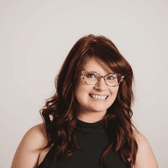 Portrait of Mara, a professional stylist at Salon Sublime, showcasing their expertise and style.