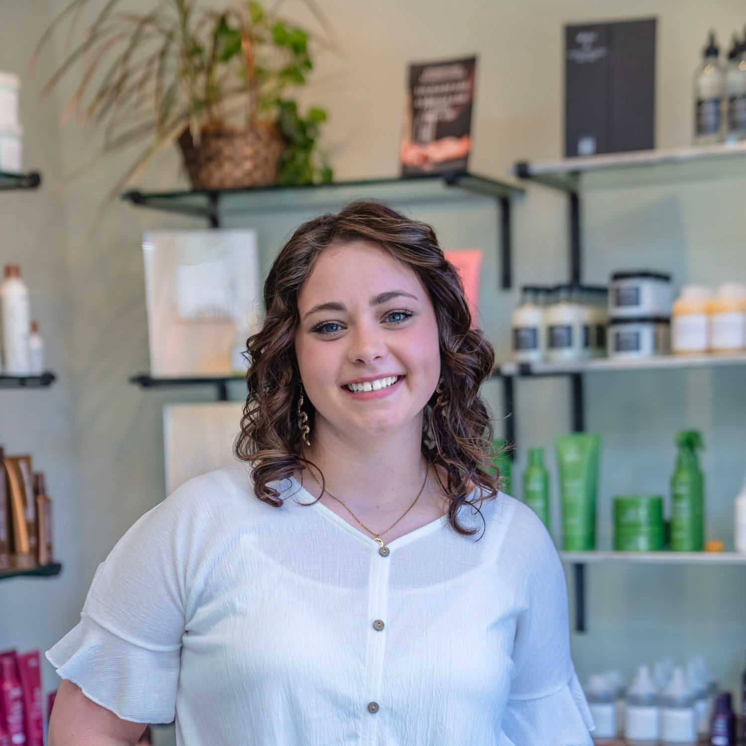 Portrait of Brittany, a professional stylist at Salon Sublime, showcasing their expertise and style.