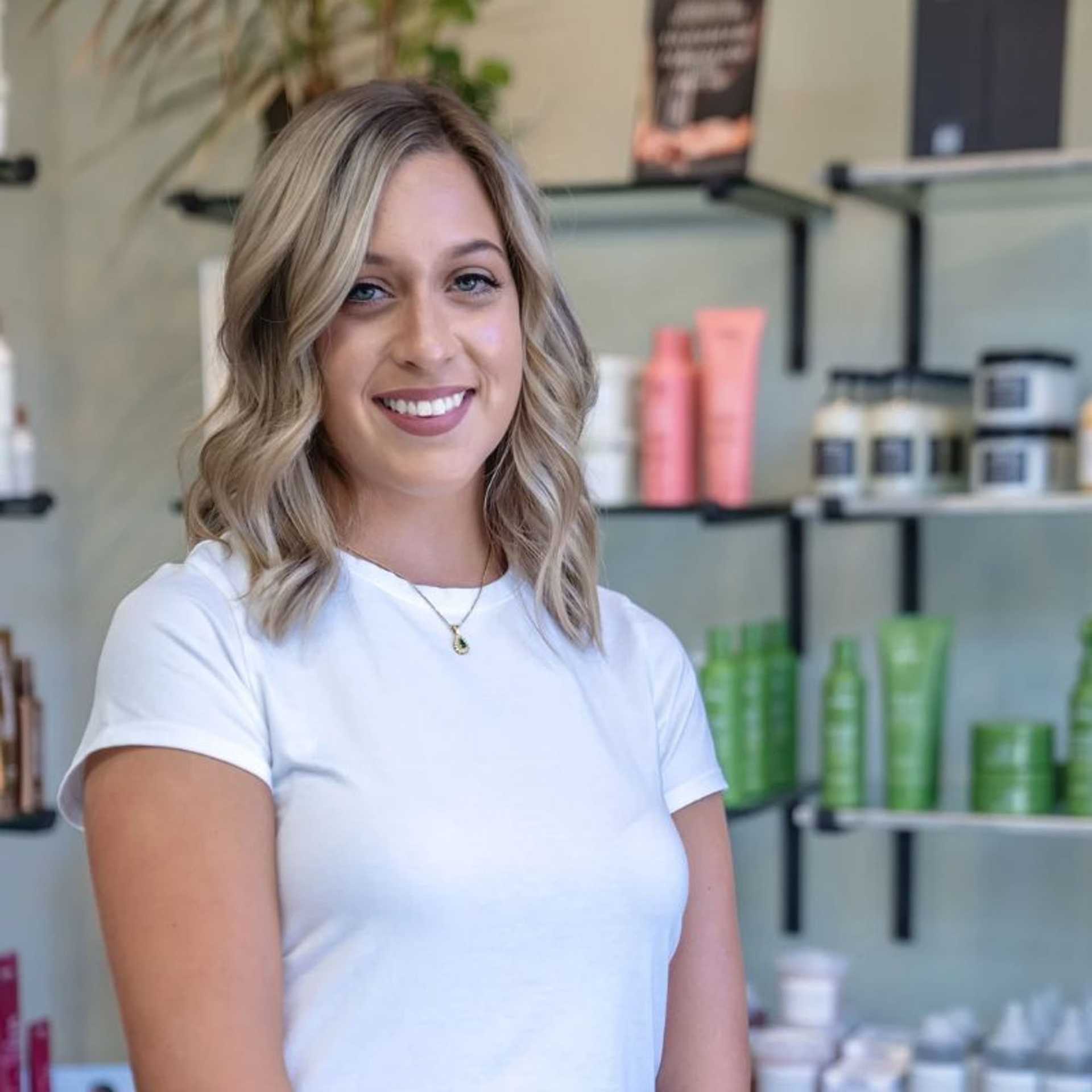 Portrait of Elizabeth, a professional stylist at Salon Sublime, showcasing their expertise and style.