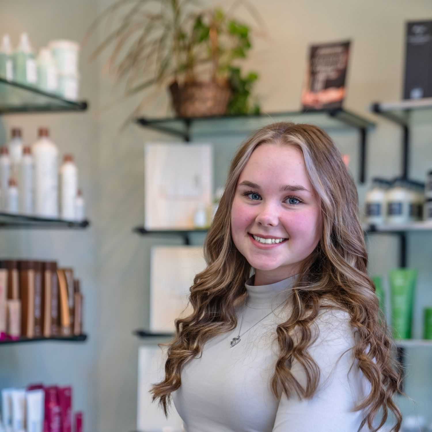 Portrait of Hailey, a professional stylist at Salon Sublime, showcasing their expertise and style.