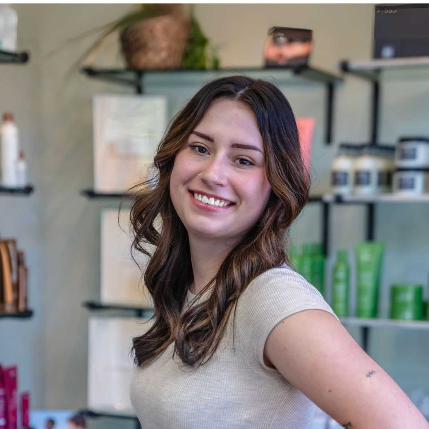 Portrait of Olivia, a professional stylist at Salon Sublime, showcasing their expertise and style.