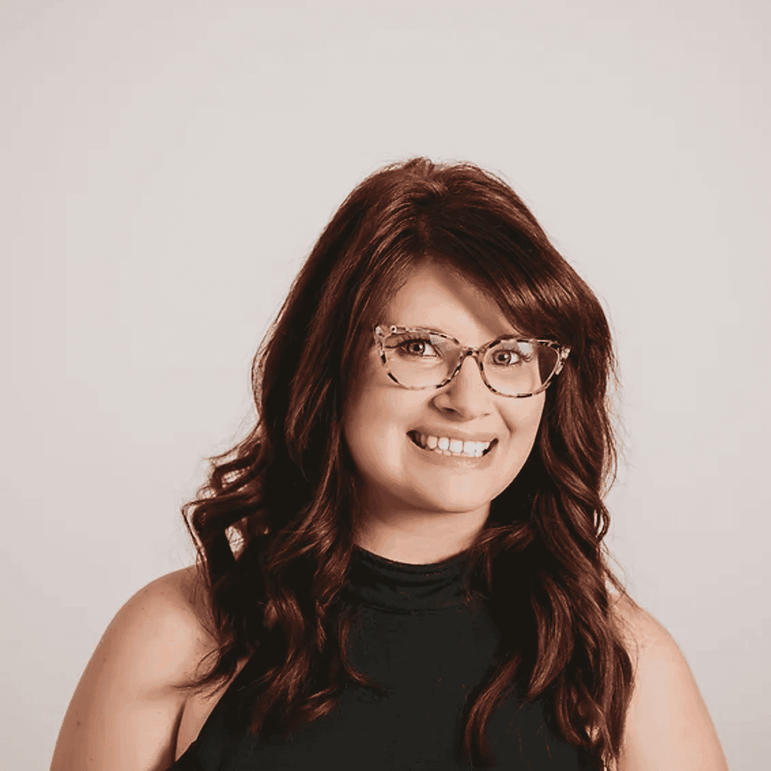 Portrait of Mara, a professional stylist at Salon Sublime, showcasing their expertise and style.